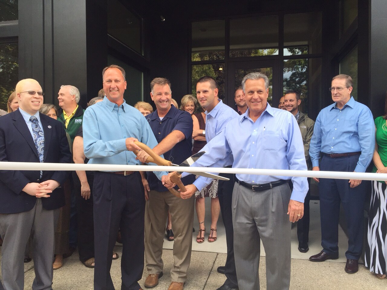 Ribbon cutting ceremony celebrating the reopening of 140 East Ash Street, September 2015